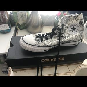 Flowery high tip converse.